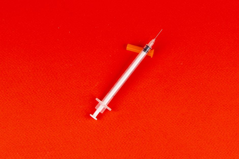 A healthcare professional reviewing an immunisation schedule